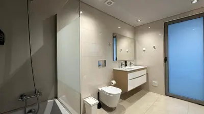 a bathroom with a toilet and a shower and a sink at Albuhera - Private Pool - 8 Pax - Albufeira in Albufeira
