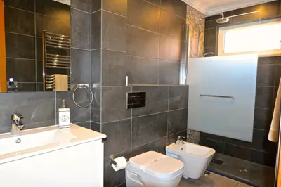 a bathroom with a toilet and a sink at Marina Plaza 162 - Clever Details in Vilamoura