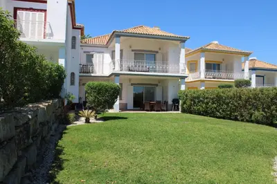 a view of the house from the yard at Luxury 2 Bedroom Apartment with Private Garden in Almancil