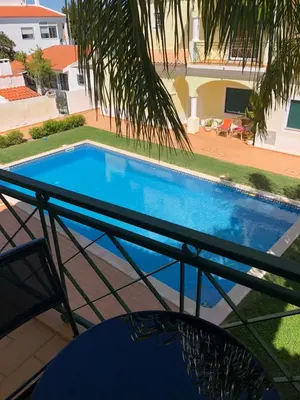 a view of a swimming pool from the balcony of a house at Rockfield 4 in Albufeira