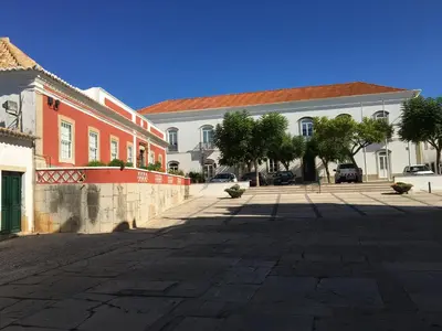 an empty street in front of a building at Casa #SerJo in São Brás de Alportel