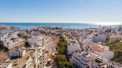 an aerial view of a city with the ocean at VERASOL 3 in Albufeira