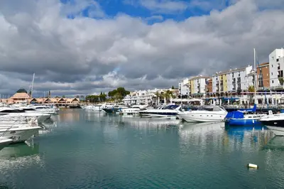a bunch of boats are docked in a harbor at Amora Villa Sacha in Vilamoura
