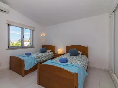 two beds in a room with a window at Villa Arribas Villa by Interhome in Patroves