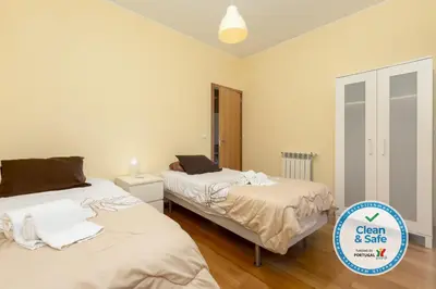 a bedroom with two beds and a sign that says clean and safe at Villa 14 Marina de Albufeira in Albufeira
