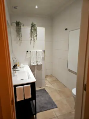 a bathroom with a sink and a toilet at villa yvonne,private pool,private parking 1,7 km from the beach in Albufeira