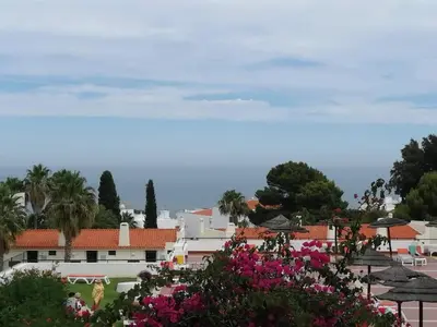 a view of a city with pink flowers at Sea View 3 in Albufeira