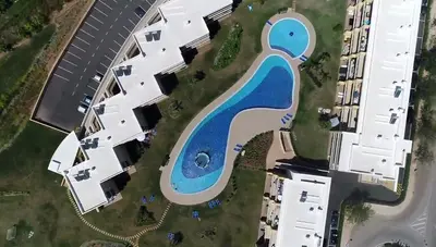 an aerial view of a swimming pool in a building at Spacious apartment in Albufeira with pool and terrace in Albufeira
