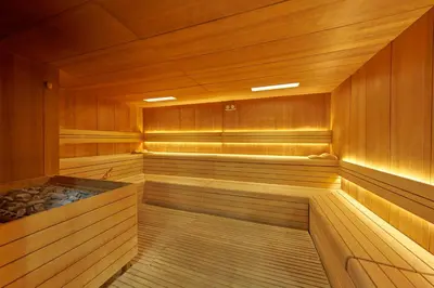 a room with two beds and a table in it at PortoBay Blue Ocean in Albufeira