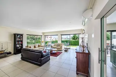 a living room with a couch and a table at Villa Sao Joao in Caliços