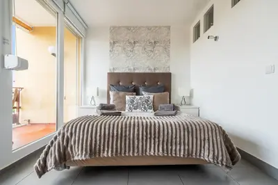 a room with a glass door leading to a bedroom at SUITEON7TH VILAMOURA THE BEST VIEW IN TOWN - 1Br in Quarteira