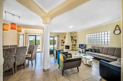 a living room with a couch and chairs at Villa Charlota in Albufeira