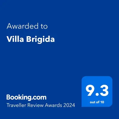 a screenshot of a cell phone with the text awarded to villa bibliography at Villa Brigida in Albufeira