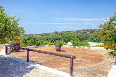 a living room with a couch and a table at Villa Monte de Madrinha in Albufeira