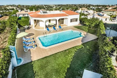 an aerial view of a house with a swimming pool at Villa Lourenco in Albufeira