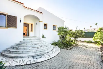 a group of steps leading up to a white house at Villa Lourenco in Albufeira