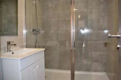 a bathroom with a shower and a sink at Rua José Afonso in Albufeira