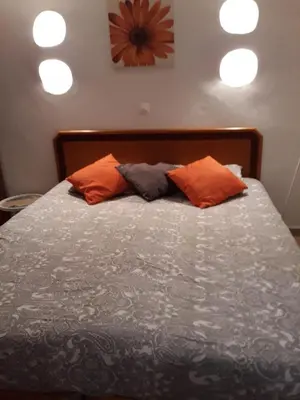 a bedroom with a bed with two pillows on it at Casa Boneca - Aldeia das Açoteias in Albufeira