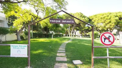 a sign for a park with a no left turn sign at Casa Boneca - Aldeia das Açoteias in Albufeira