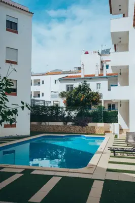 a swimming pool in front of a building at Apartamentos Old Town by Umbral in Albufeira