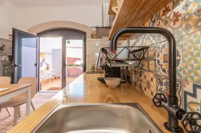a kitchen with a sink and a counter top at FARO DOWNTOWN STUDIOS in Faro