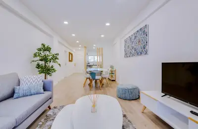 a living room with a couch and a tv at Ella - Fantastic apartment - Vilamoura in Vilamoura