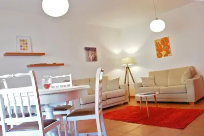 a living room with a couch and a table at Martin House - Montenegro - FARO - ALGARVE in Faro