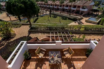 an overhead view of a courtyard with chairs and a building at Vilasol apartment by Intiholidays in Vilamoura