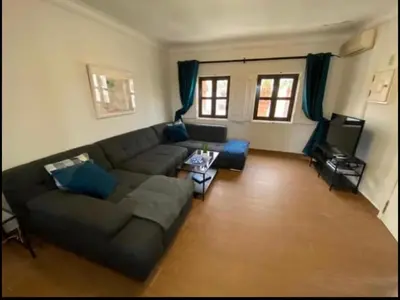 a living room with a couch and a tv at Vilamoura 2 bed new apartment in Vilamoura