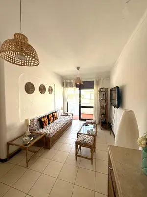 a living room with a couch and a tv at Olimar Sea View Apartment in Albufeira