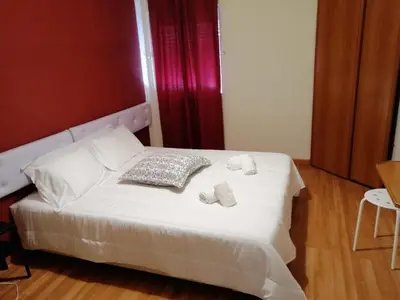a bedroom with a white bed with two towels on it at Guesthouse RSA by Umbral in Almancil
