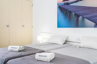 two beds sitting next to each other with towels on them at Villa Magna - Apt- 206 by HelloVacations in Albufeira