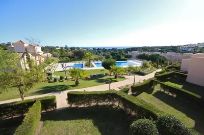 an aerial view of a park with a pool at Pinheiros da Balaia Villas in Albufeira