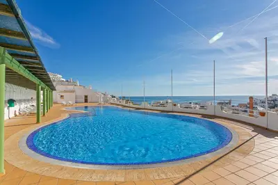 a large swimming pool on the balcony of a building at AZUL/MAR ALBUFEIRA 602 in Albufeira