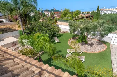 an overhead view of a garden with palm trees and benches at Villa Ruana - 5 bedrooms on Suite- Free out door Hot Jacuzzi - By Bedzy in Albufeira