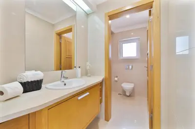 a bathroom with a sink and a toilet at Villa Duma in Albufeira
