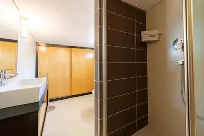 a bathroom with a shower and a sink at Villa Maria in Albufeira