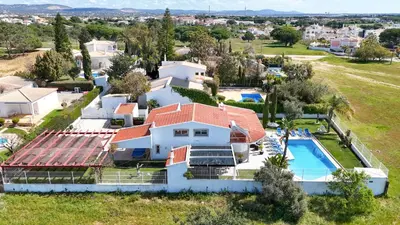 an aerial view of a house with a swimming pool at Villa Maria in Albufeira