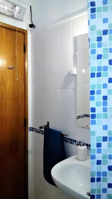 a bathroom with a sink and a mirror at Sunny Apartment Close to the Beach in Albufeira