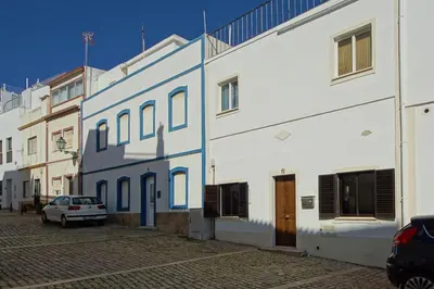 a group of buildings with a car parked next to them at CASA 4 - Perfect location - Sea view by DreamvillasAlbufeira in Albufeira