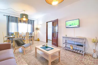 a living room with a couch and a table at Casa dos Avós by MTPhomes in Albufeira