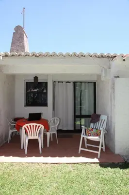 a patio with a table and chairs and a table and chairs at Acoteias Studio by be@home in Albufeira