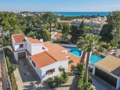 an aerial view of a house with a swimming pool at Casa das Anas by HelloVacations in Albufeira
