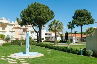 a monument in a park in front of a building at Santa Eulália Apartment Luxury - Blue Sea in Albufeira