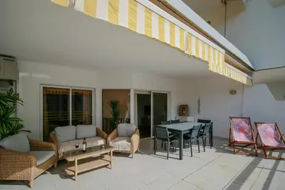 a living room with a couch and a table at FLH Vilamoura Sunny Apartment with Pool in Vilamoura