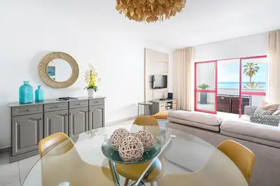 a bedroom with two beds and a window at Apartamento Zacarias by Ferias com Sol in Quarteira