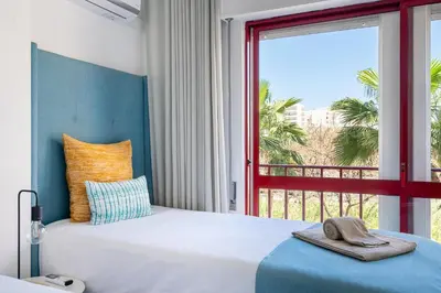 a bathroom with a toilet and a bidet at Apartamento Zacarias by Ferias com Sol in Quarteira