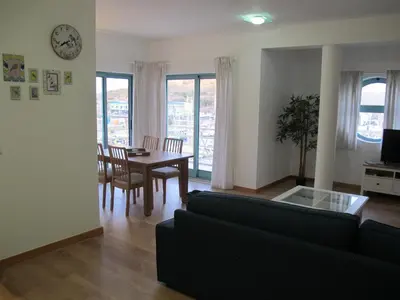 a living room with a couch and a table at AMM SeaView Marina Albufeira apartment in Albufeira