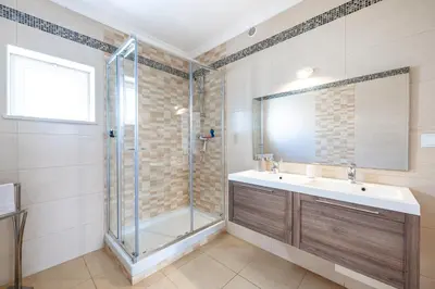 a bathroom with a sink and a shower at Full private 180sqm Villa - Terrace Jacuzzi - 200m Beach & Sea View in Albufeira