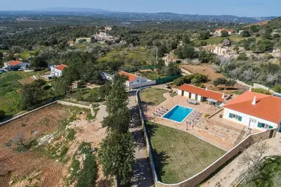 an aerial view of a house with a swimming pool at Villa Rita in Silves